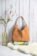 Cartera cuero carpincho con forro lino mostaza